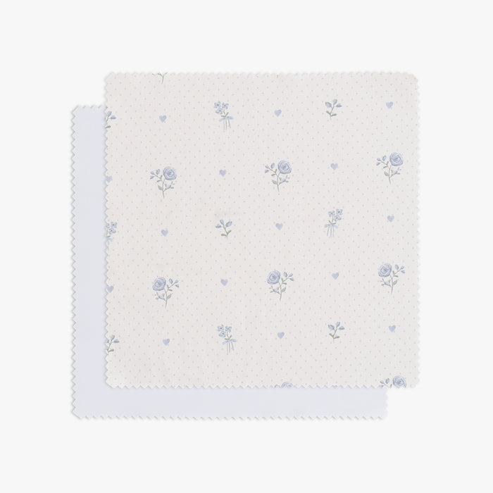 Ditsy Floral patterned swatch with blue flowers on a white background