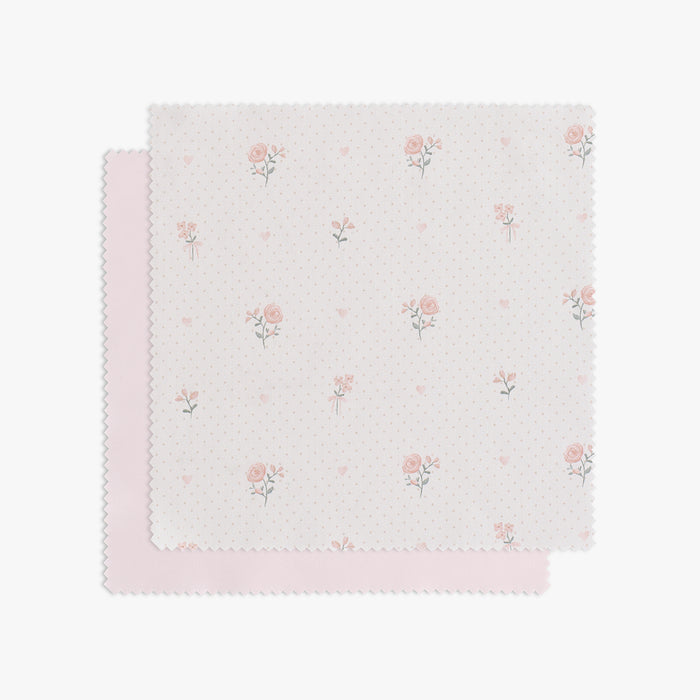 Swatch of Ditsy Floral in Pink. Pink flowers on a soft dotted background.