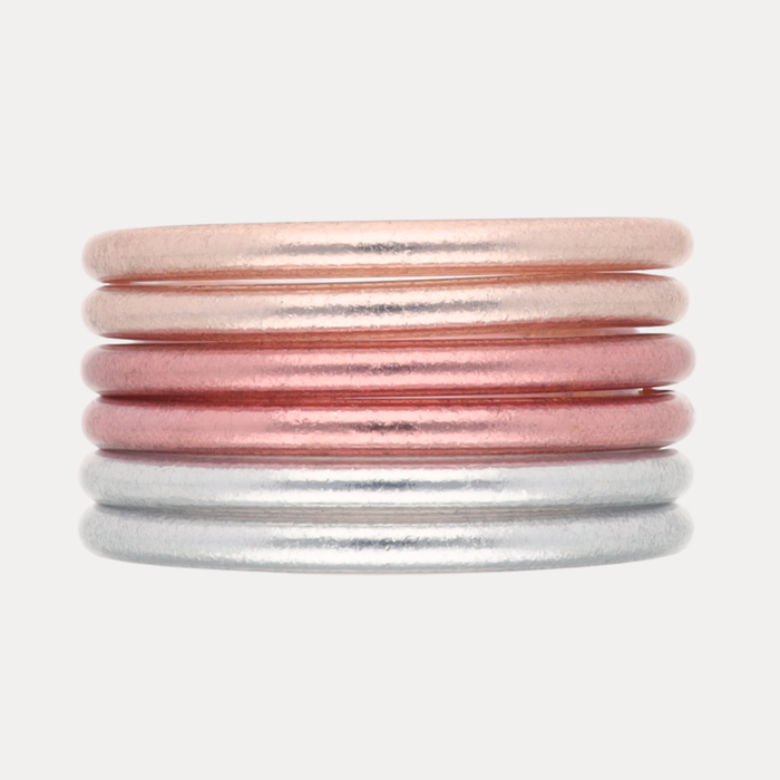 Blush Core Mixed Stack of six handcrafted bangles in Champagne, Rose Gold, and Silver for a romantic wrist accent.