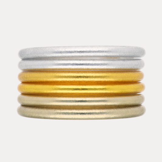 Essentials Core Mixed Stack featuring silver and gold bangles for a timeless style.