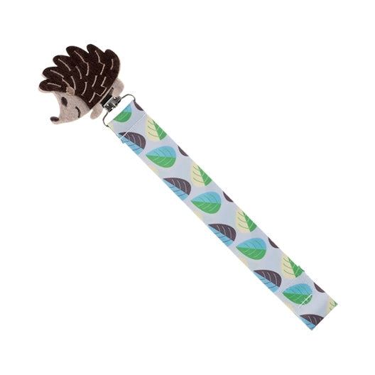 The Nuby Felt Pacifier Clip features a plush brown hedgehog and a patterned strap with blue and green leaves to keep your baby's pacifier both handy and cute.