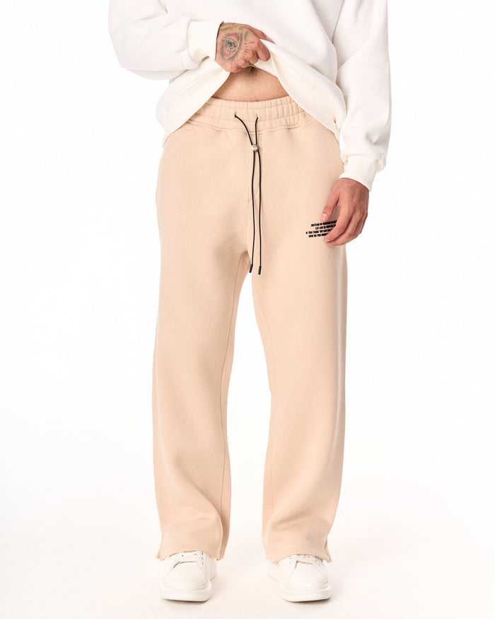 Martin Valen MV beige baggy sweatpants front waist view showing elastic waistband, black drawcord and metal stopper
