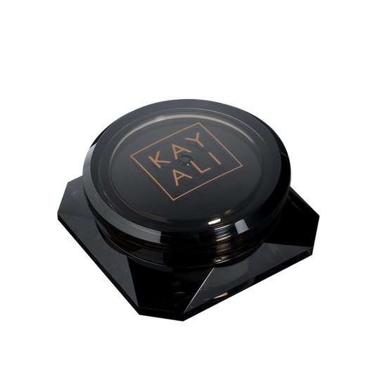 Black cosmetic compact with 'KAYALI' branding on a white background