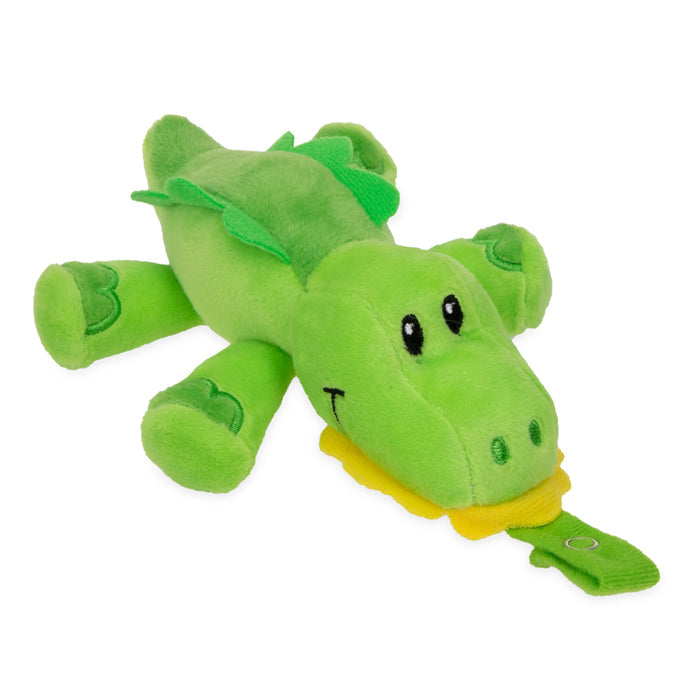 The Snuggleez Pacifier and Clip Combo Set features a soft, green alligator plush with big eyes, felt scales, stitched leg details, and a yellow tag—perfect for soothing baby’s gums from 0-6 months.